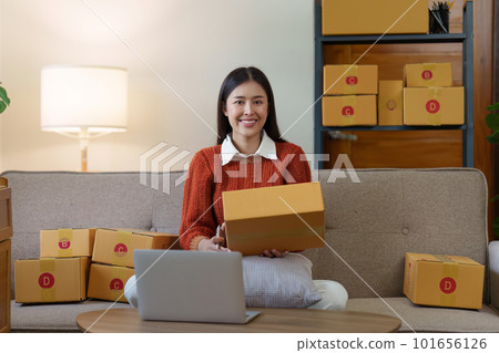 Small businesses SME owners female entrepreneurs check online orders to prepare to pack the boxes, sell to customers, sme business ideas online Small businesses SME owners female entrepreneurs check online orders to prepare to pack the boxes, sell to customers, sme business ideas online 101656126