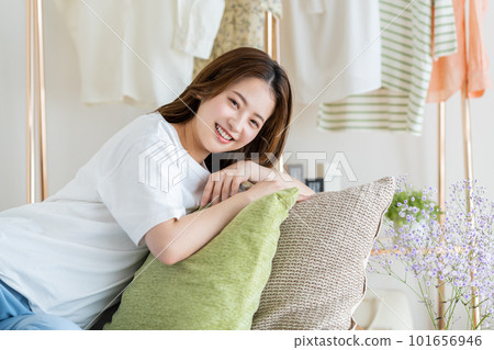 Young woman relaxing in the living room Young woman relaxing in the living room 101656946