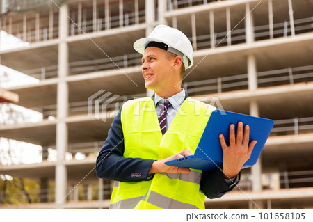 Architect with laptop computer on building site Architect with laptop computer on building site 101658105