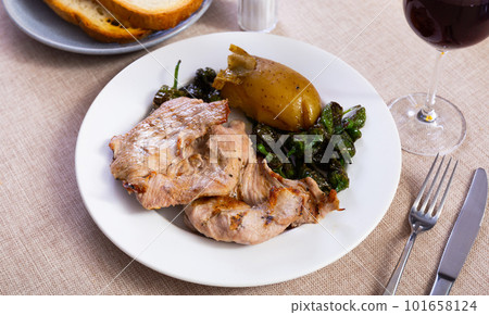 Baked pork with potatoes and pepper 101658124