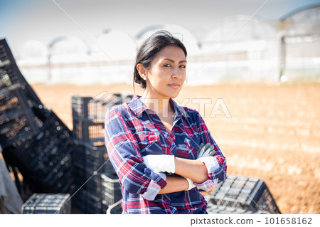 Peruvian woman farmer with arms crossed Peruvian woman farmer with arms crossed 101658162