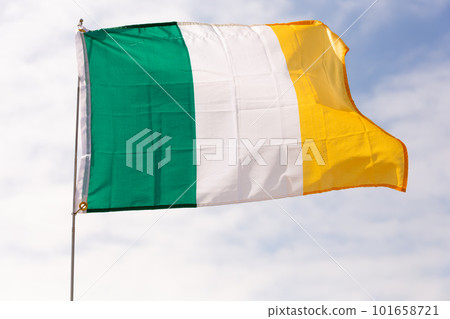 Flag of Ireland waving on cloudy sky during daytime Flag of Ireland waving on cloudy sky during daytime 101658721