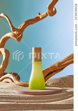 A gradient green color with wooden cap standing on a round podium decorated with sand and tree branch. Natural product mockup A gradient green color with wooden cap standing on a round podium decorated with sand and tree branch. Natural product mockup 101659926