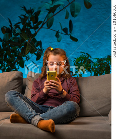 Teenager girl in neon light room 101660016