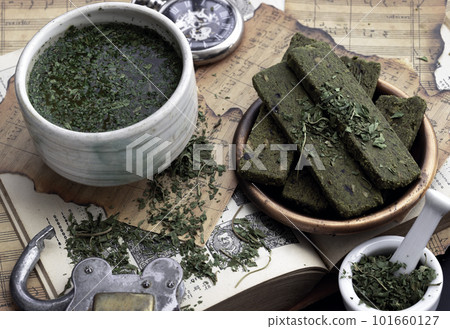 Enjoy with A Cup of CBD herbal tea is served with the Homemade Cannabis Snack Sticks on the Old Music Notebook. Enjoy with A Cup of CBD herbal tea is served with the Homemade Cannabis Snack Sticks on the Old Music Notebook. 101660127