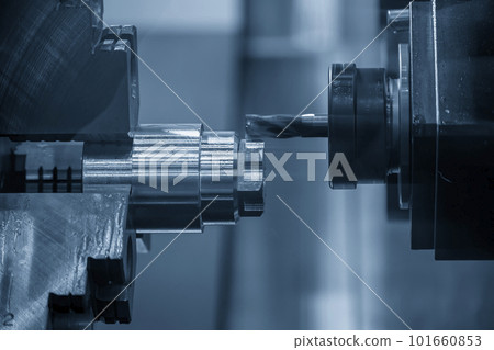 The multi-tasking CNC lathe machine milling cut the metal shaft parts by milling spindle. The multi-tasking CNC lathe machine milling cut the metal shaft parts by milling spindle. 101660853