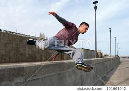 Man doing parkour. Extreme sports Man doing parkour. Extreme sports 101661042