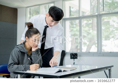 University students study hard and listen to teachers for their lessons with special lectures in the columns of math class University students study hard and listen to teachers for their lessons with special lectures in the columns of math class 101662277