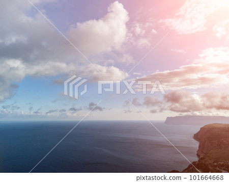Aerial view. The drone flies over foggy and fluffy clouds. Blue sky sun and sea fog. Abstract aerial nature summer ocean sunset sea and sky background. Horizon. Vacation, travel and holiday concept Aerial view. The drone flies over foggy and fluffy clouds. Blue sky sun and sea fog. Abstract aerial nature summer ocean sunset sea and sky background. Horizon. Vacation, travel and holiday concept 101664668