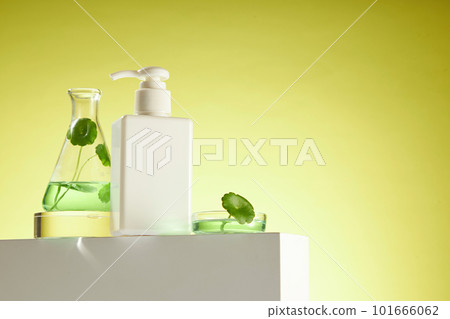 Mockup scene for cosmetics product of gotu kola extract with white empty plastic bottle on white podium. Gotu kola and essence decorated on petri dish on yellow background. Front view. Mockup scene for cosmetics product of gotu kola extract with white empty plastic bottle on white podium. Gotu kola and essence decorated on petri dish on yellow background. Front view. 101666062
