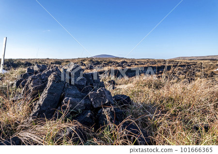 Peat Turf cutting in County Donegal - Ireland Peat Turf cutting in County Donegal - Ireland 101666365