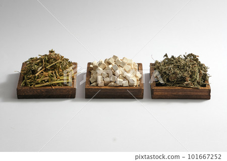 Some square wooden trays with Chinese motherwort, Poria cocos and Mugwort displayed on. White background. Herbs useful in treat health problems Some square wooden trays with Chinese motherwort, Poria cocos and Mugwort displayed on. White background. Herbs useful in treat health problems 101667252