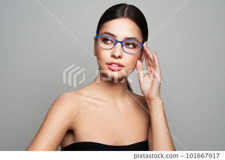 Woman with long eyelashes in eyeglasses 101667917