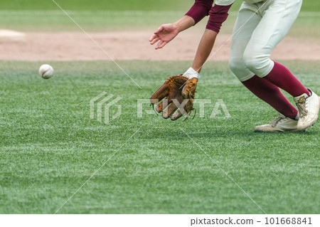 A second infielder who catches a batted ball during a baseball game A second infielder who catches a batted ball during a baseball game 101668841