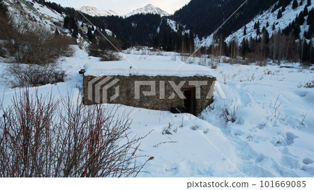 An old stone prison or hut in the mountains. An old stone prison or hut in the mountains. 101669085