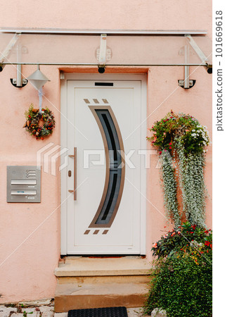 Wood Door. A Beautiful Old Wooden Door. Old Doors, Fragments Of Old Doors, Texture Of Old Wooden Doors. Door Old Europe House History. Old house entrance with stairs, wooden door, windows and pink 101669618