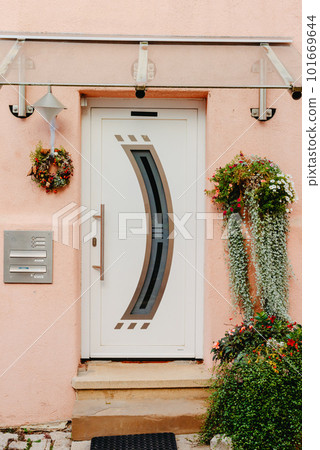 Wood Door. A Beautiful Old Wooden Door. Old Doors, Fragments Of Old Doors, Texture Of Old Wooden Doors. Door Old Europe House History. Old house entrance with stairs, wooden door, windows and pink Wood Door. A Beautiful Old Wooden Door. Old Doors, Fragments Of Old Doors, Texture Of Old Wooden Doors. Door Old Europe House History. Old house entrance with stairs, wooden door, windows and pink 101669644