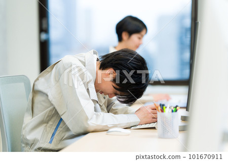 Tired businessman in work clothes 101670911