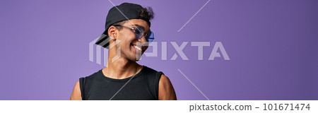Portrait of transgender male in black t-shirt and blue jeans. Latino trans gender model posing 101671474