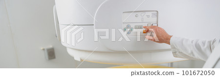 Woman patient is ready to do magnetic resonance imaging MRI or CT scan in clinic Woman patient is ready to do magnetic resonance imaging MRI or CT scan in clinic 101672050