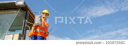 Multiracial construction worker using heavy machinery in plant Multiracial construction worker using heavy machinery in plant 101672081