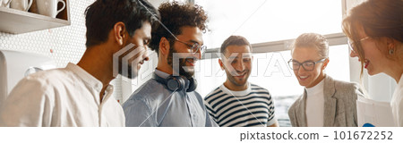 Diverse group of colleagues enjoying working together in an office. Teamwork concept 101672252