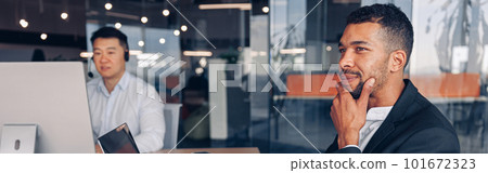 Two multiracial business people working in modern coworking 101672323