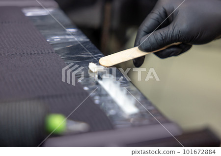 Tattoo master preparing equipment for tattoo session 101672884