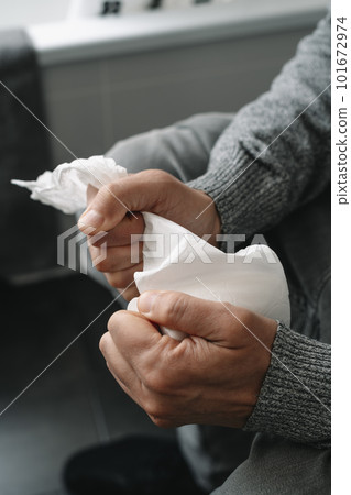 man sitting in the toilet grabbing the toilet paper 101672974