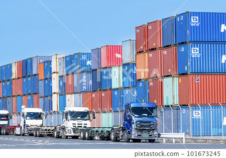 Trailers and shipping containers stacked awaiting their turn to be loaded 101673245