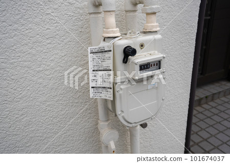 Gas meter installed on the outer wall of a house Gas meter installed on the outer wall of a house 101674037