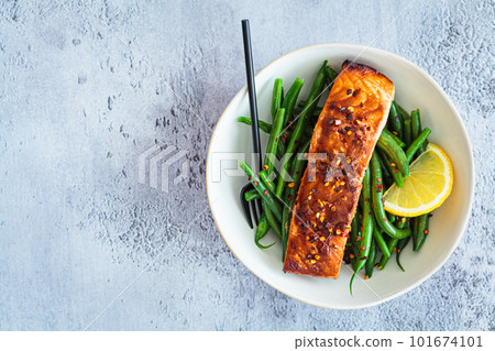 Spicy teriyaki salmon with green beans. 101674101