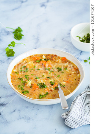 Vegan stew with potatoes, sweet potato and lentils in white bowl. Plant-based recipe. Vegan stew with potatoes, sweet potato and lentils in white bowl. Plant-based recipe. 101674107