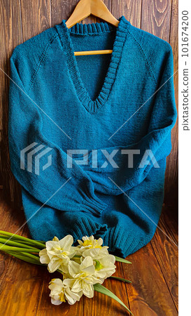 Knitted handmade products. Knitted fabric of colored threads in the color of petrol. Knitted handmade products. Knitted fabric of colored threads in the color of petrol. 101674200