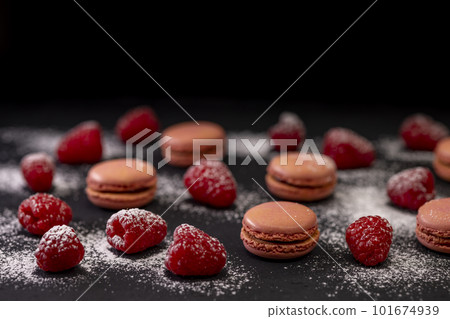 macaroons of different colors on a black background macaroons of different colors on a black background 101674939