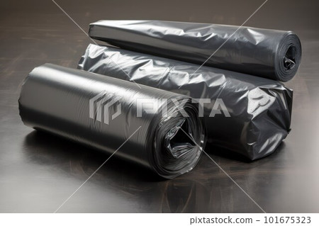 Black rolls of large size plastic garbage bags in a factory or production plant 101675323