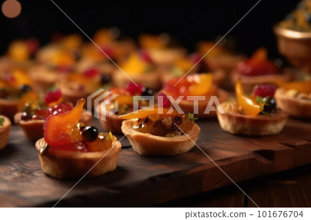 assortment of small ones. canapés with fruit and meat or fish filling  101676704
