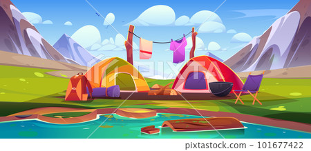 Mountain camp with tents and campfire near lake 101677422