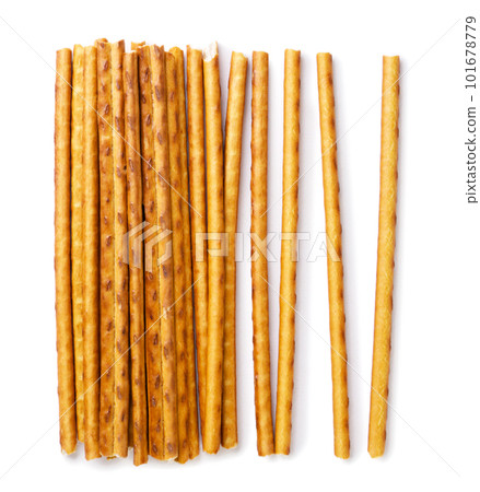 Pretzel sticks scattered on a white background. Top view 101678779