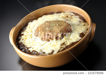Hot grilled curry with plenty of cheese and hamburger on a black background Hot grilled curry with plenty of cheese and hamburger on a black background 101679896