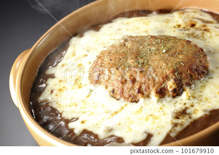 Hot grilled curry with plenty of cheese and hamburger on a black background Hot grilled curry with plenty of cheese and hamburger on a black background 101679910