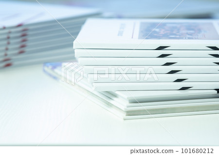 stack of freshly printed photobooks on the table close-up stack of freshly printed photobooks on the table close-up 101680212