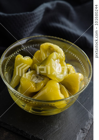 Peppers stuffed with cream cheese in bowl. 101680244