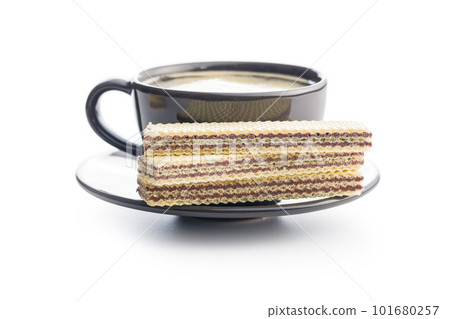 Sweet chocolate wafer and coffee cup isolated on white background. Sweet chocolate wafer and coffee cup isolated on white background. 101680257