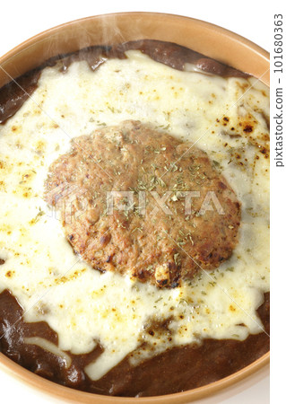 A bird's-eye view of a hot curry with plenty of cheese and hamburger on a white background A bird's-eye view of a hot curry with plenty of cheese and hamburger on a white background 101680363