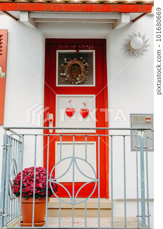 Wood Door. A Beautiful Old Wooden Door. Old Doors, Fragments Of Old Doors, Texture Of Old Wooden Doors. Door Old Europe House History. Old house entrance with stairs, wooden door, windows and pink 101680669