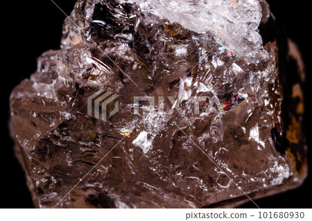 Macro mineral stone smoky quartz Rauch topaz on black background 101680930