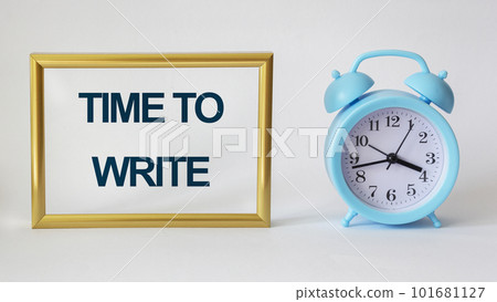 TIME TO WRITE text in wooden frame on white background with clock 101681127