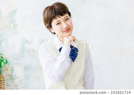 Female high school student sitting with a smile Female high school student sitting with a smile 101681724