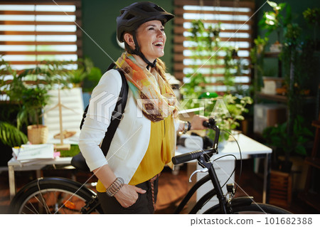 smiling business woman in bike helmet in eco office smiling business woman in bike helmet in eco office 101682388
